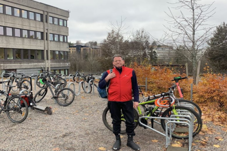 Man standing in front of bike racks