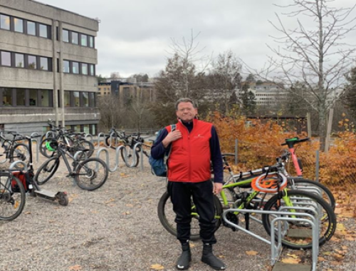 Man standing in front of bike racks